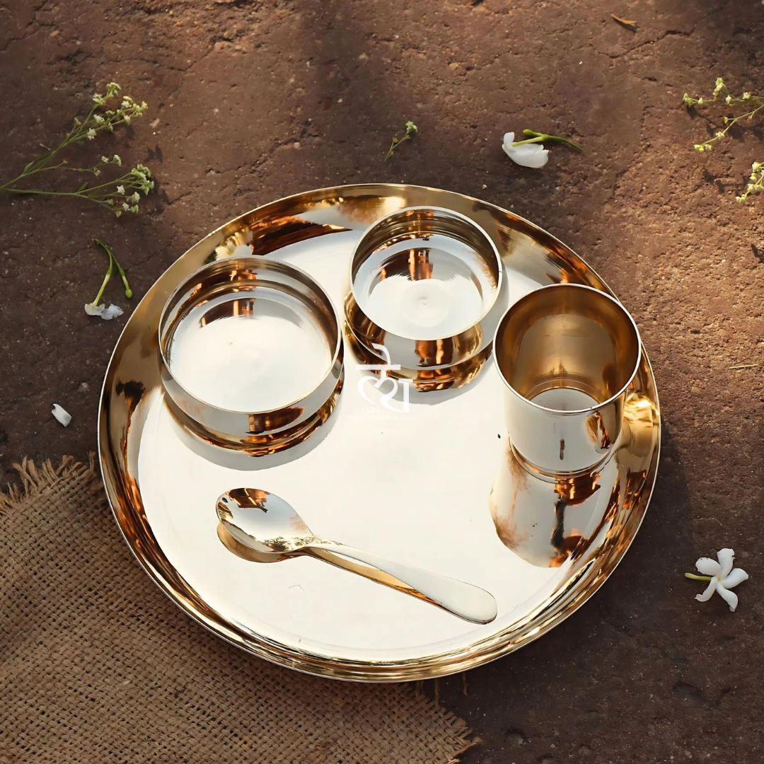 Luminous Heritage bronze 5-piece dinner set with artisan finish, including plates, bowls, and serving pieces